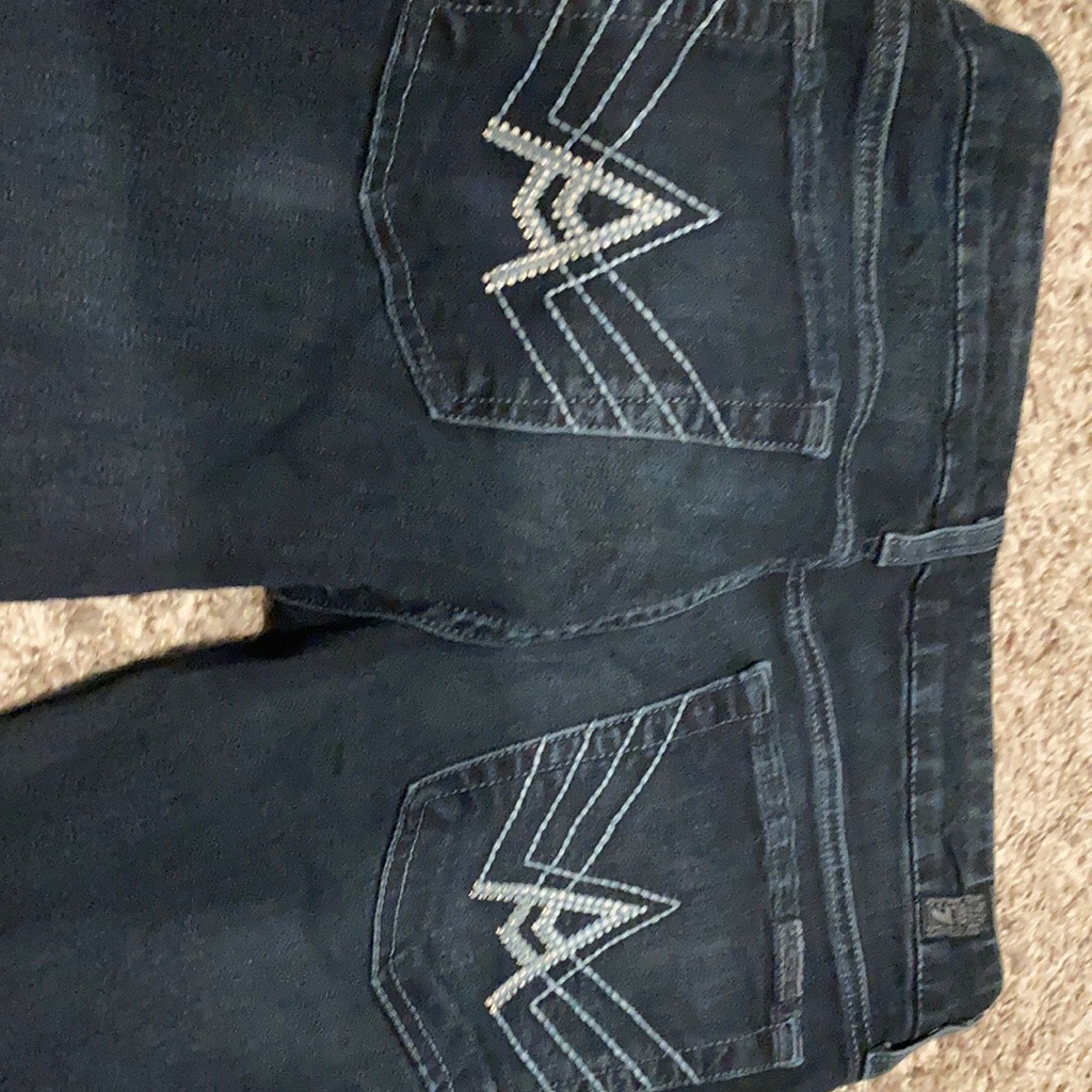 A Pocket Seven For All Man Kind Jeans.
